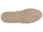 Semelle de chaussure espadrille avec motif texturé et bordure en jute tressée.