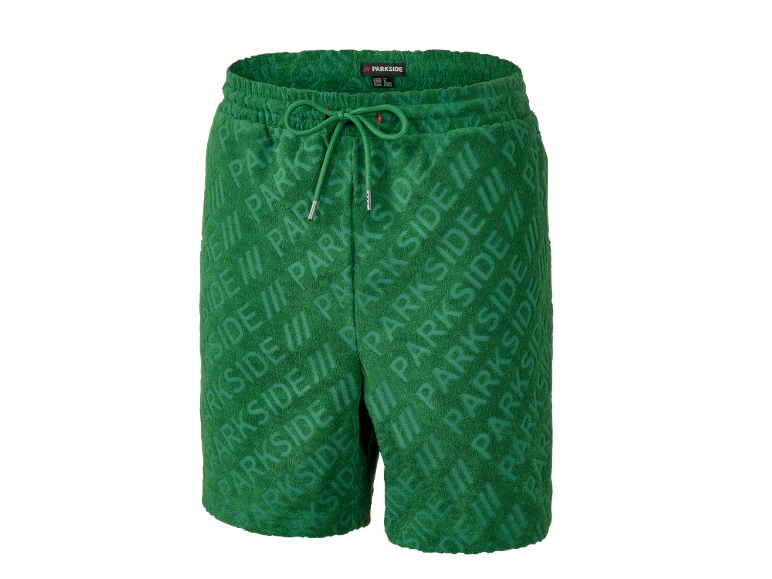 Shorts éponge verts avec un motif de texte répété.