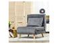 Fauteuil lounge gris avec coussin dans un salon avec paravent en bois.