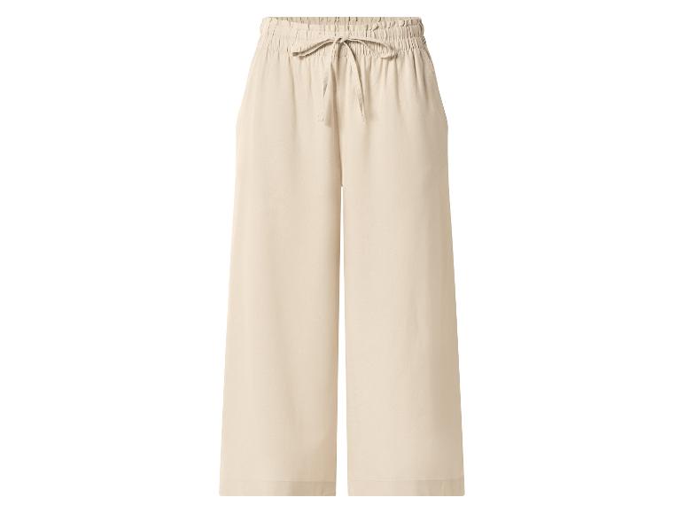 Pantalon large beige avec taille élastique et cordon de serrage.