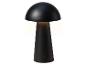 Lampe de table noire en forme de champignon avec interrupteur tactile, émettant une lumière chaude.