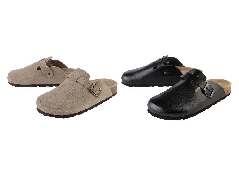 Sandales en daim beige et noir avec boucle.