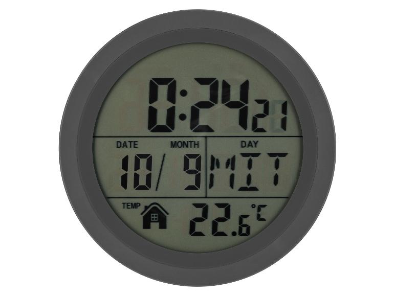 Horloge numérique ronde affichant l'heure, la date et la température.