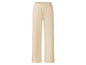 Pantalon de survêtement beige avec des poches.