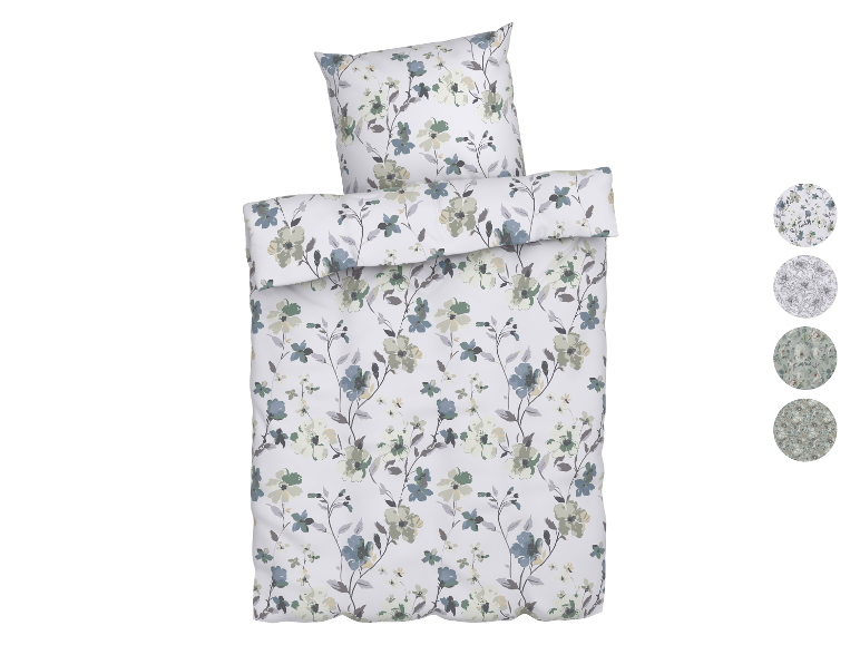 Parure de lit fleurie aux tons verts et bleus.