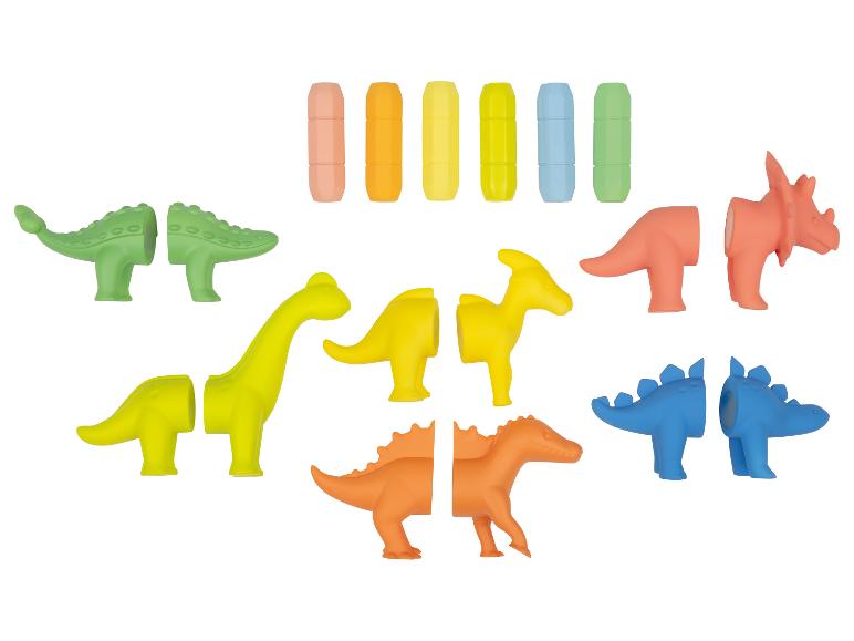 Ensemble de jouets dinosaures colorés avec pièces interchangeables et capsules de rangement.