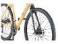 Vélo de gravel Prophete Graveler beige avec pneus et détails noirs.