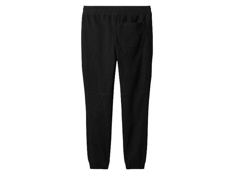 Pantalon de survêtement noir pour homme avec poche arrière et poignets élastiques.