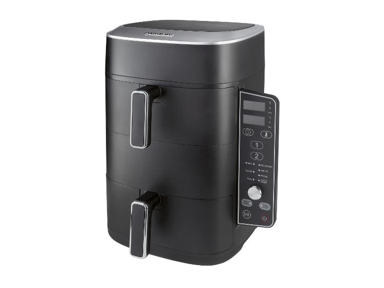 Friteuse à air noire à double panier avec affichage numérique et fonctions de cuisson multiples.