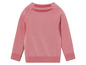 Un sweat à manches longues rose avec des panneaux en mesh pour l'entraînement