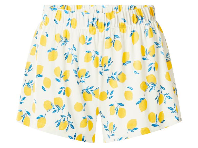 Short blanc avec motif de citrons jaunes et feuilles bleues.