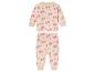 Pyjama pour bébé à manches longues, de couleur crème avec un imprimé rose d'arbres et de cœurs.