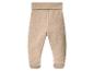 Pantalon de bébé beige avec pieds