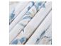 Draps et taies d'oreiller à motifs bleus et beiges.