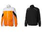 Deux vestes de sport Crivit, une orange et blanche, l'autre noire, sur fond blanc.