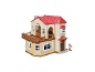 Maison de poupée jouet avec toit rouge, balcon et boîte aux lettres.