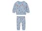 Un sweat-shirt et un pantalon bleus avec un motif d'hiver pour bébés.
