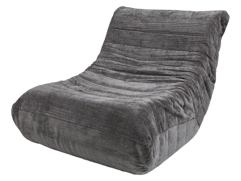 Fauteuil de salon gris rembourré avec un design texturé et plissé