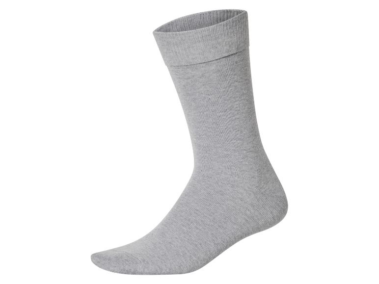 Chaussette en coton grise, vue latérale, sur fond blanc.