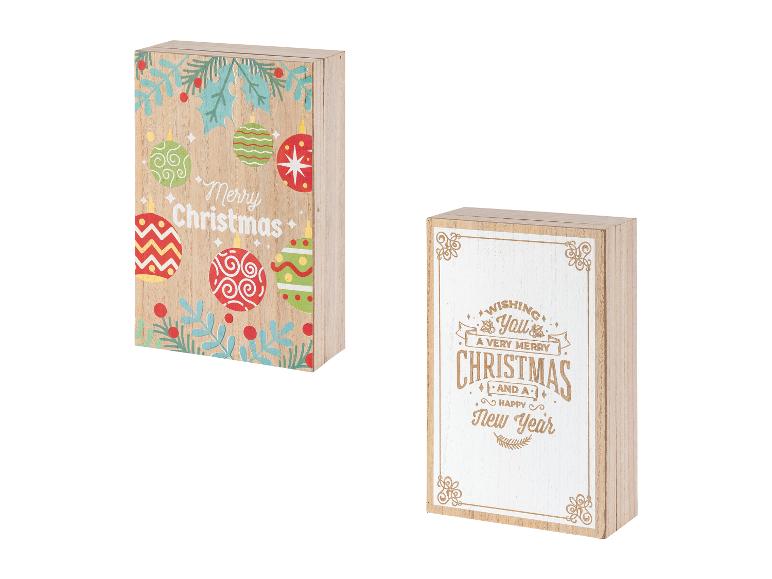 Deux panneaux de Noël en bois, l'un avec des ornements colorés et l'autre avec du texte.