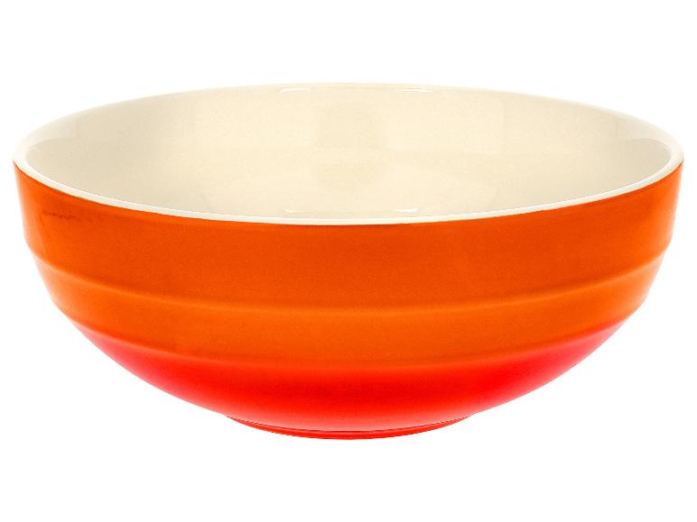 Bol orange et crème avec des rainures horizontales.
