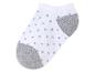 Chaussettes blanches à pois gris.