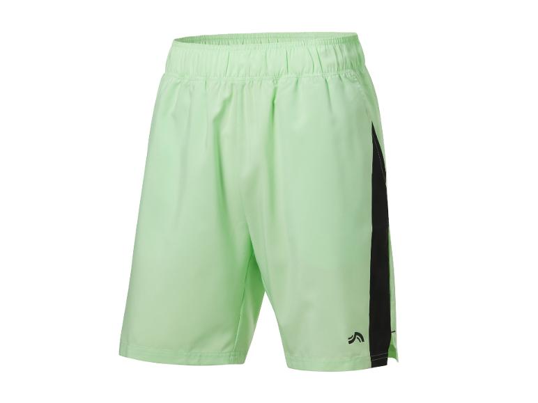 Shorts de sport vert clair avec détails noirs.