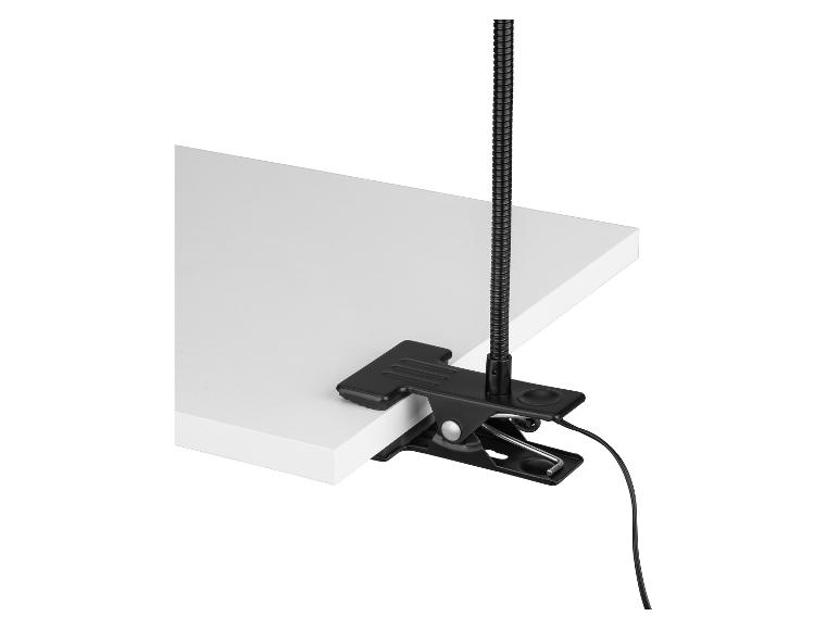 Lampe de table noire avec bras flexible et pince de fixation sur une surface blanche