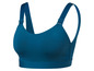 Un soutien-gorge de sport bleu foncé avec des bretelles larges.