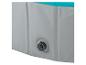 Piscine gonflable grise et turquoise avec bouchon de vidange.
