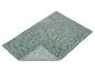Tapis de bain vert menthe avec texture bouclée et un coin replié