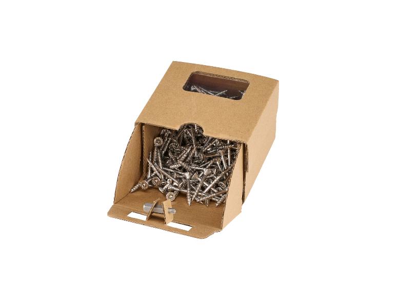 Boîte en carton ouverte pleine de vis à bois avec un embout de tournevis.