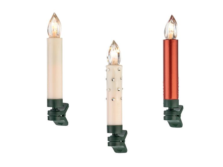 Trois bougies électriques avec pinces, une blanche, une décorée et une rouge.
