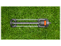 Arroseur oscillant Gardena sur pelouse.