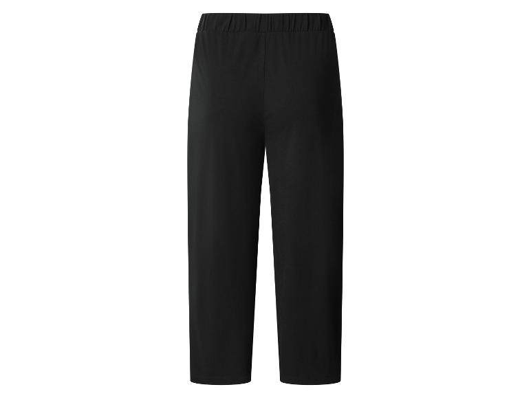 Pantalon de sport noir ample avec taille élastique.