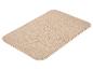 Tapis de sol rectangulaire beige aux coins arrondis.