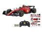 Une voiture de course Ferrari F1 rouge avec une télécommande et des autocollants