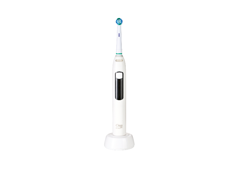 Une brosse à dents électrique Cien Beauty blanche sur sa base de chargement.