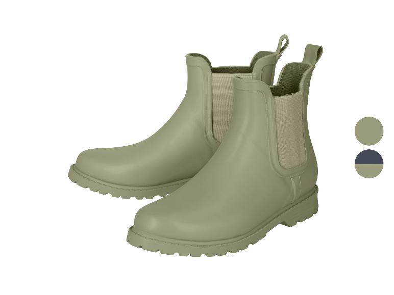 Paire de bottes de pluie Chelsea vert clair avec empiècements élastiques et tirettes.