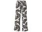 Pantalon blanc avec un motif de feuilles noires.