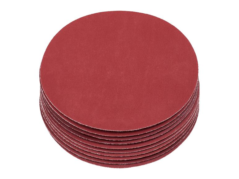 Pile de disques de ponçage ronds rouges.