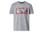 T-shirt gris à manches courtes avec imprimé graphique de texte et éclaboussures de peinture.