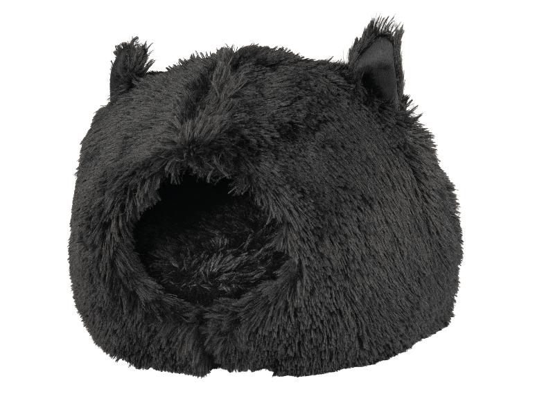 Un lit pour chat en peluche noire avec des oreilles.