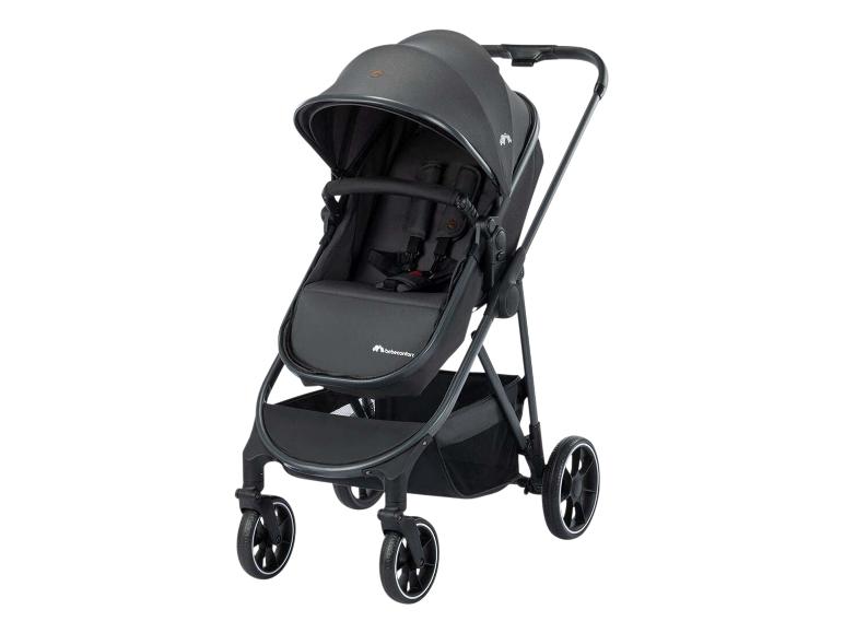 Poussette bébé gris foncé avec capote et panier de rangement.