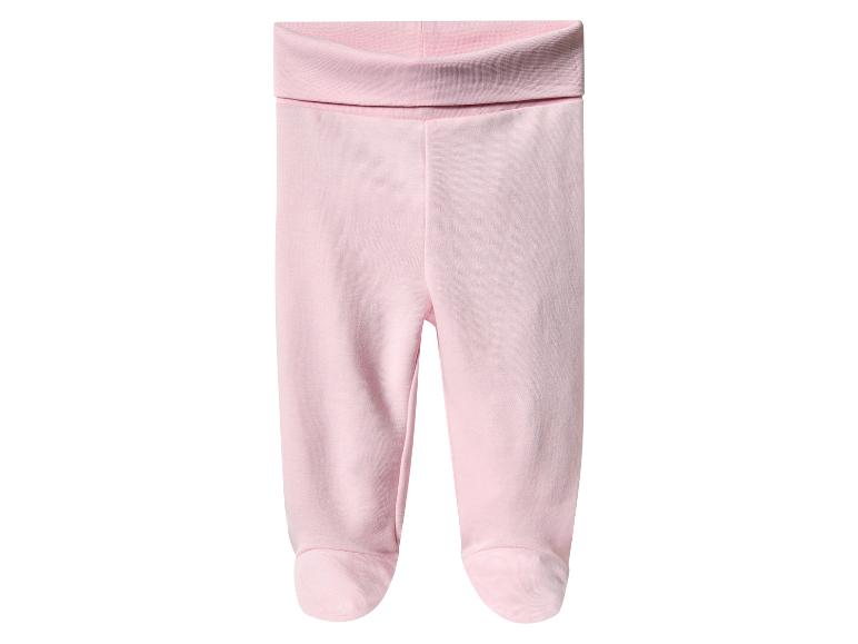 Leggings rose bébé avec des bords repliés.