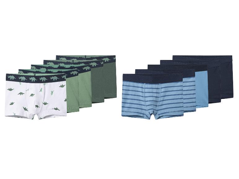 Boxers pour enfants avec motifs dinosaures et rayures dans les tons bleus et verts.