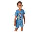 Enfant souriant en pyjama bleu avec imprimé chiots et texte 'CHILLIN' WITH MY PUP'.
