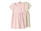 Robes d'enfants roses et beiges à manches courtes, la beige avec motif cœurs.