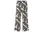 Pantalon blanc à imprimé de feuilles noires.