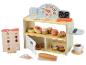 Un ensemble de jeu de boulangerie en bois avec des pâtisseries, de l'argent et une caisse enregistreuse.
